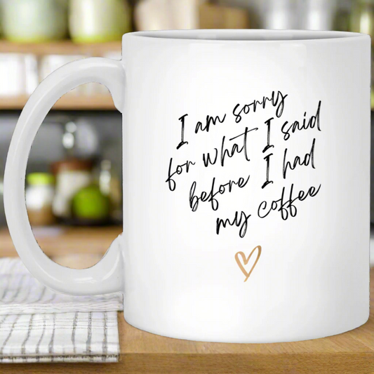 White mug with humorous text and a heart on a white background