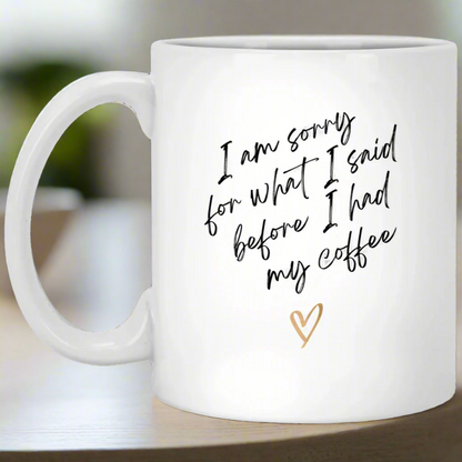 White mug with humorous text and a heart on a white background
